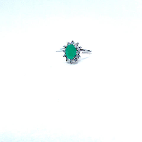 14 Karat white gold oval emerald ring with a halo of diamonds 200-00298