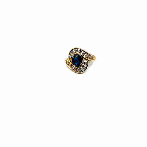 14 karat yellow gold ring with diamonds and an oval sapphire 950-01823