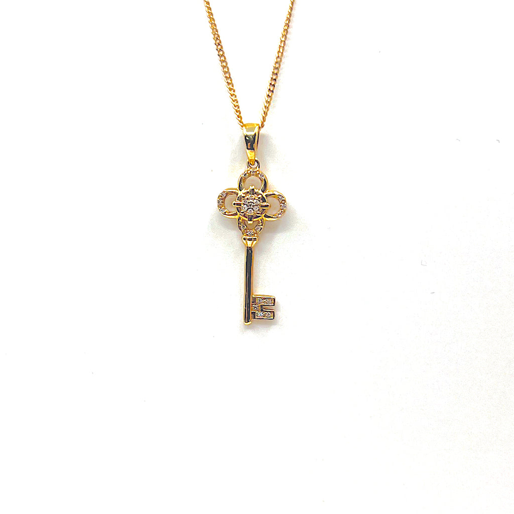 10 Karat yellow gold key pendant with 0.06 carats 160-00155