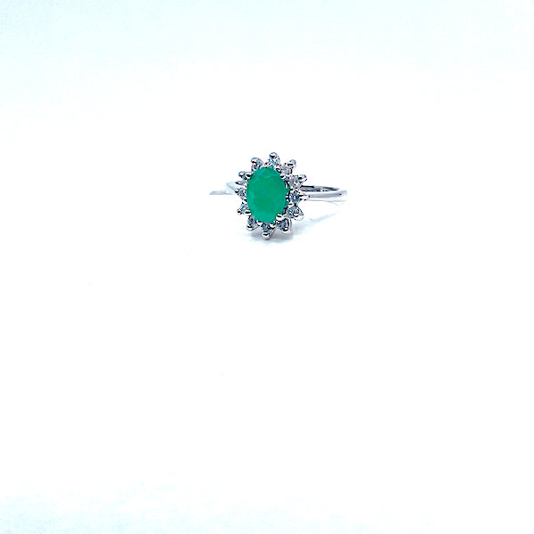 14 Karat white gold oval emerald ring with a halo of diamonds 200-00298