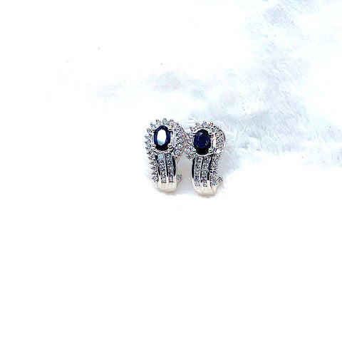 14 Karat white gold earring with 0.60 carats of diamonds and two oval sapphires 210-00005