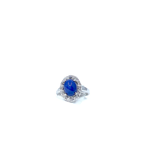 14 Karat white gold oval star sapphire ring with a halo of diamonds 950-02301